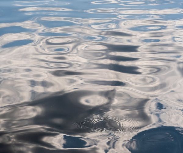 Abstract image representing airflow or gentle waves of light.